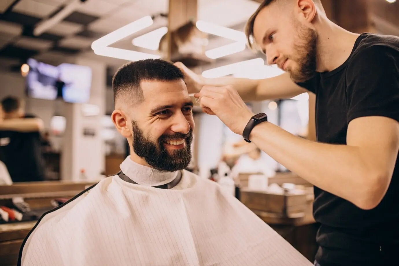 Man in a barbershop salon during a haircut and beard trim